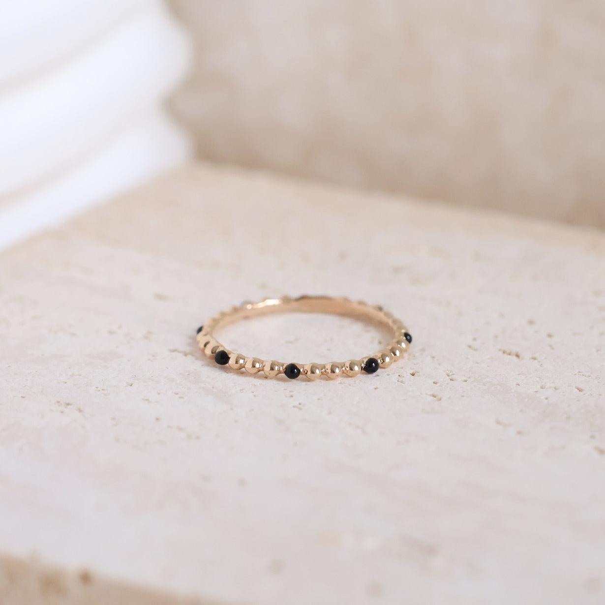 Dana beaded ring with black enamel gold-plated