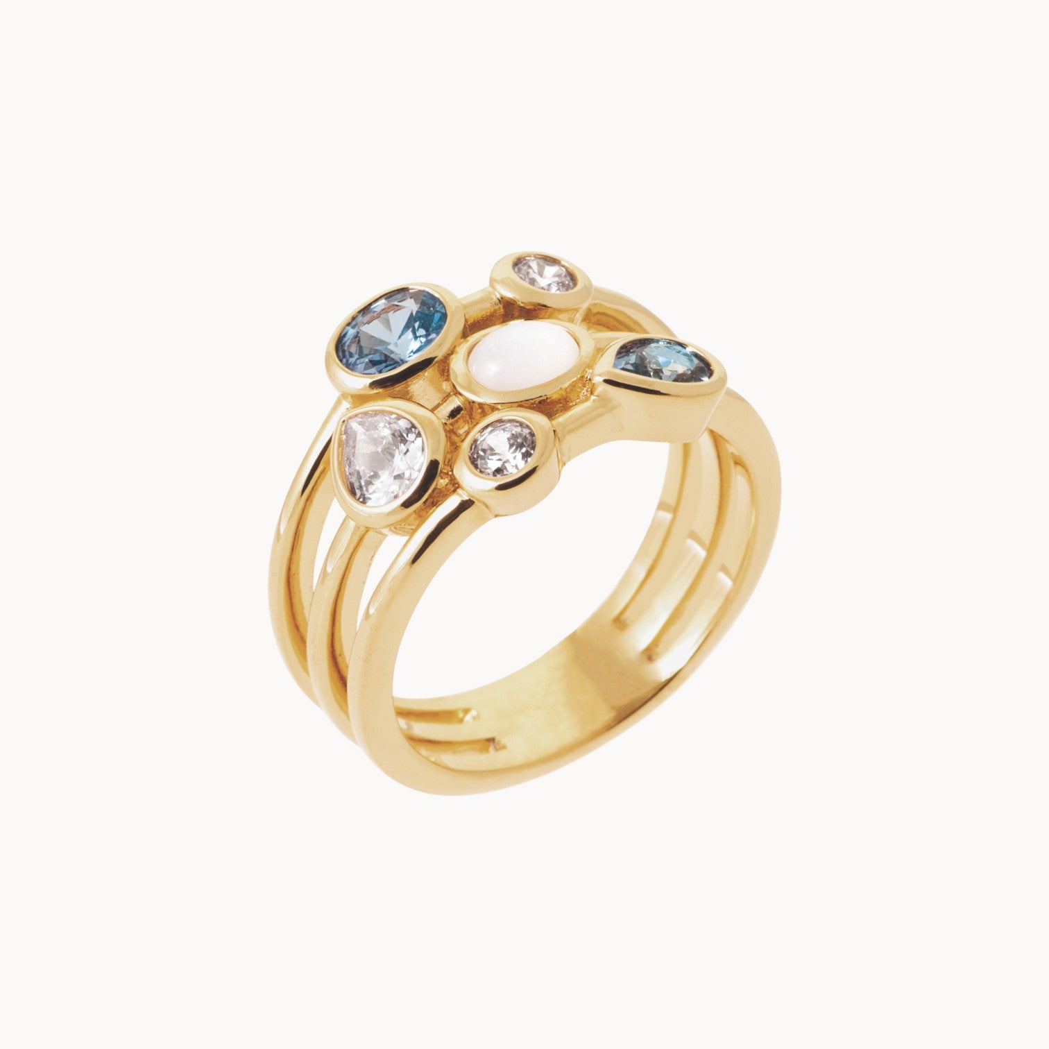 Three-row Anya ring with white and blue zircons gold plated