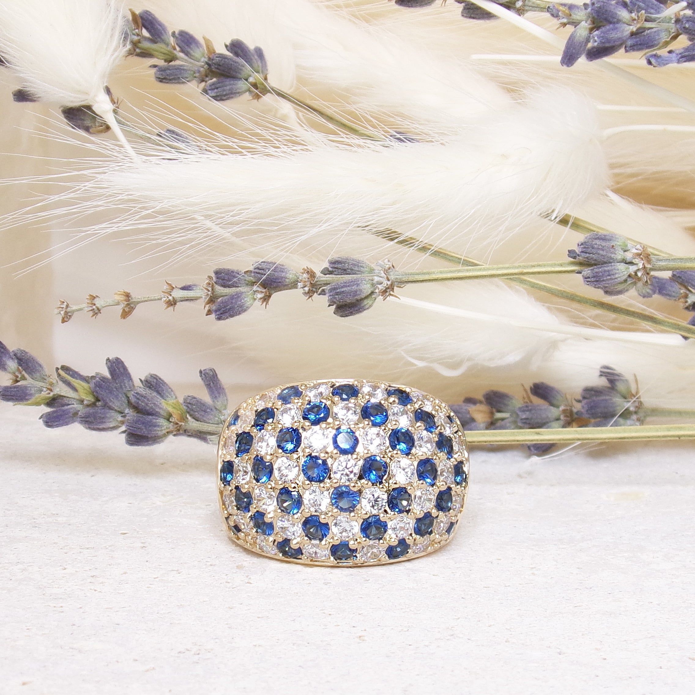 Nolita curved ring with white and blue zircons gold-plated