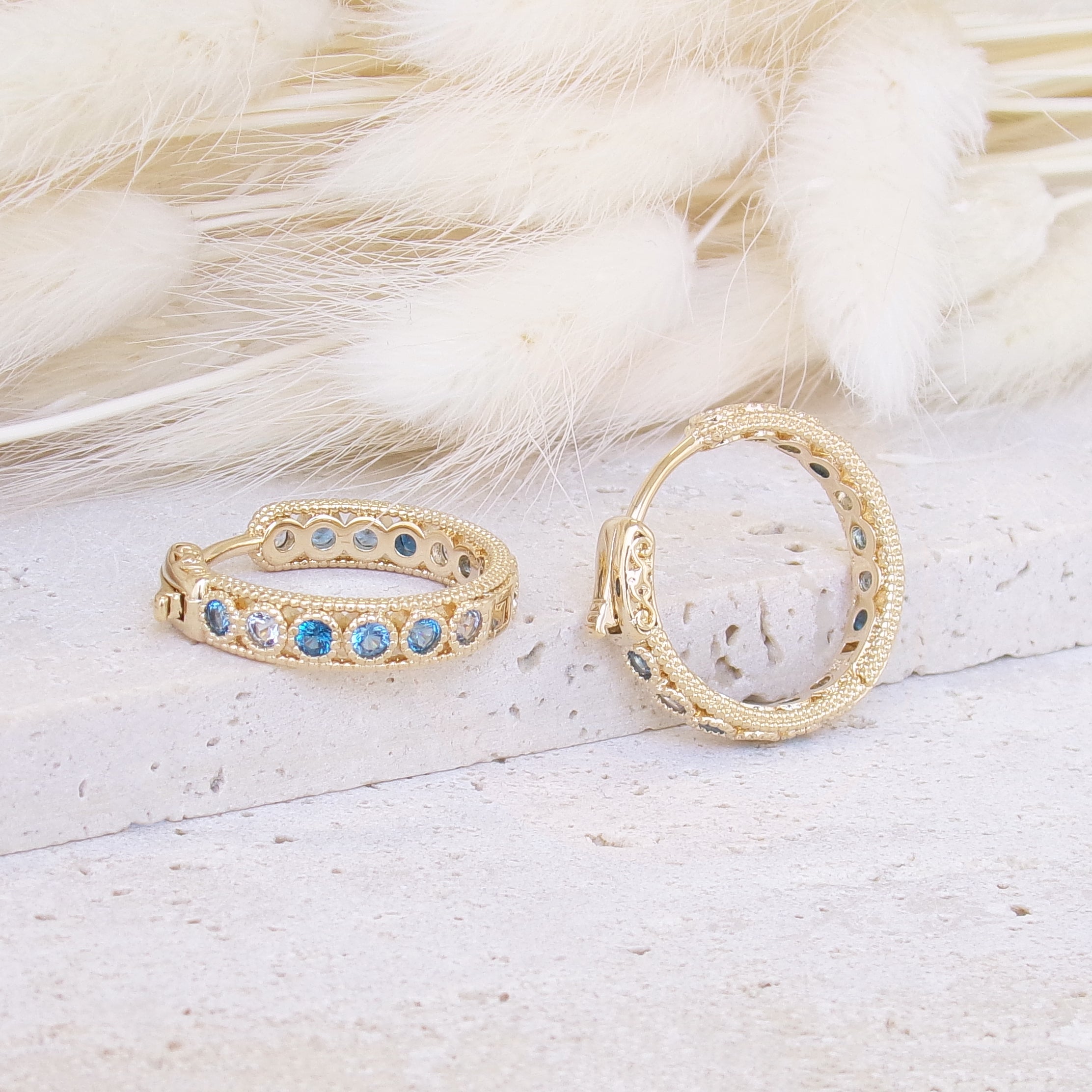 Riva hoop earrings 19mm blue zircons gold-plated