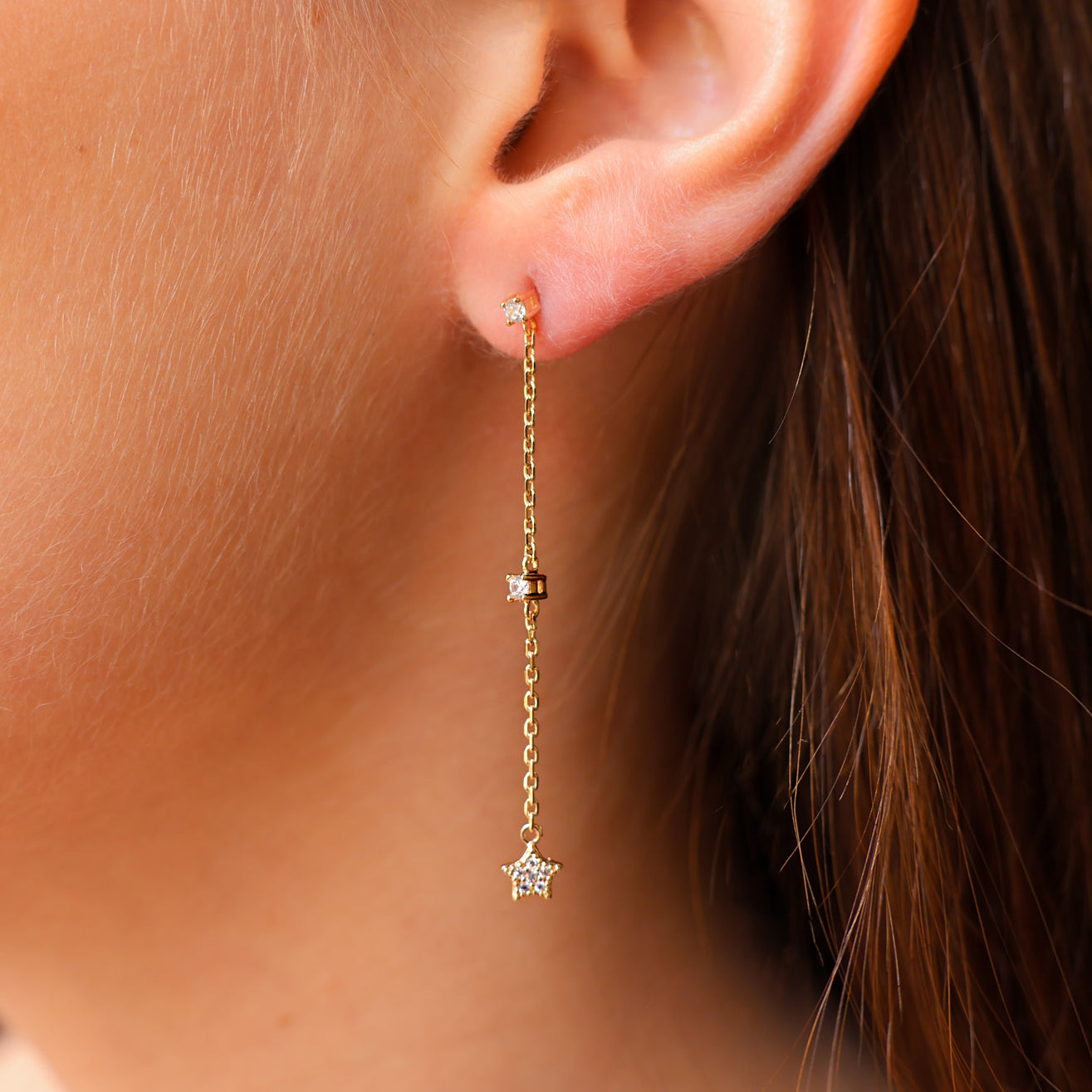 Mia earrings with chains of zircons and stars gold-plated