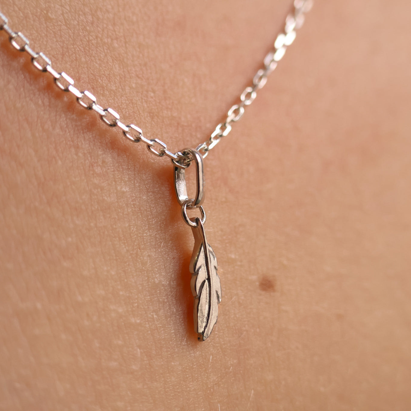 Feather charm 10mm sterling silver