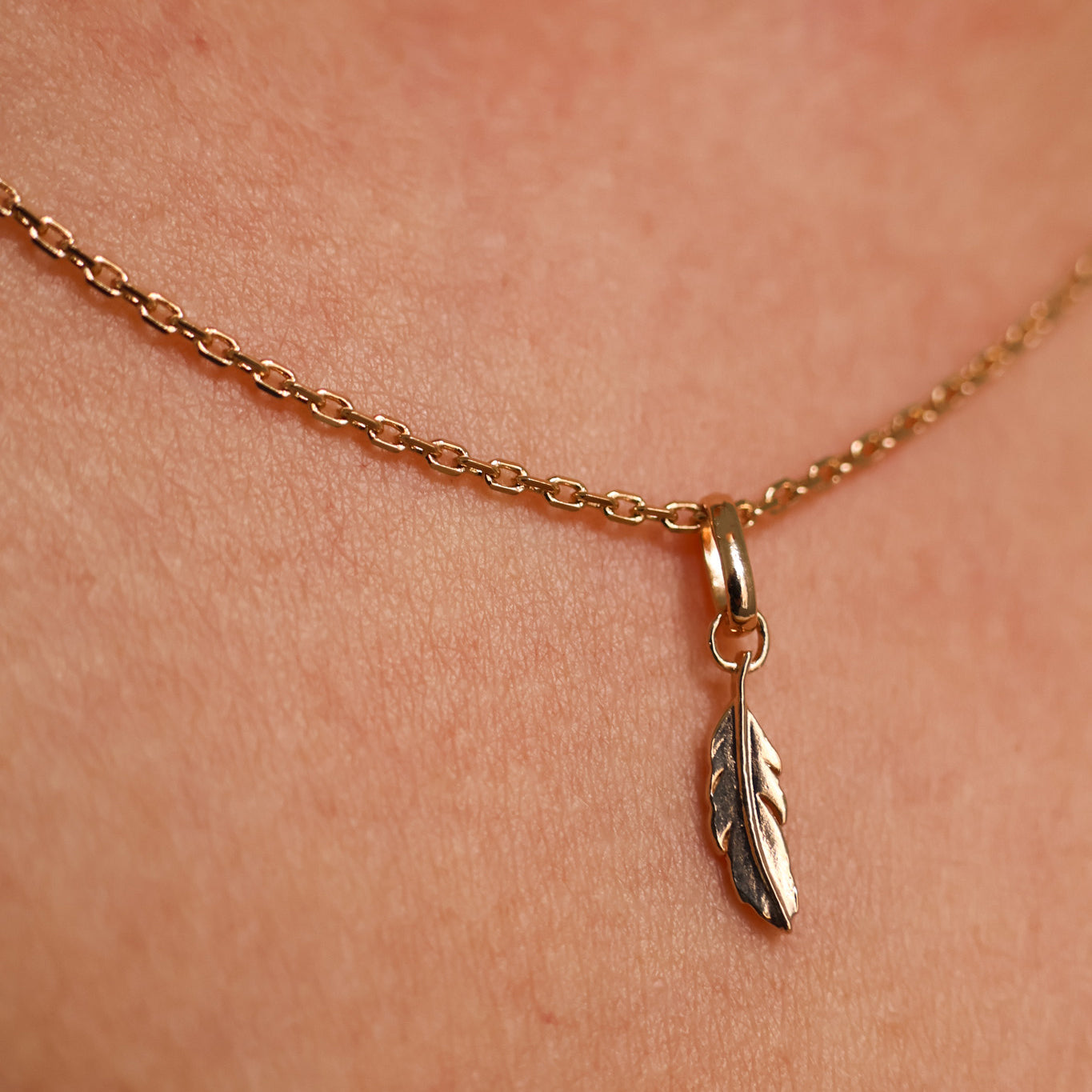 Feather charm 10mm gold-plated