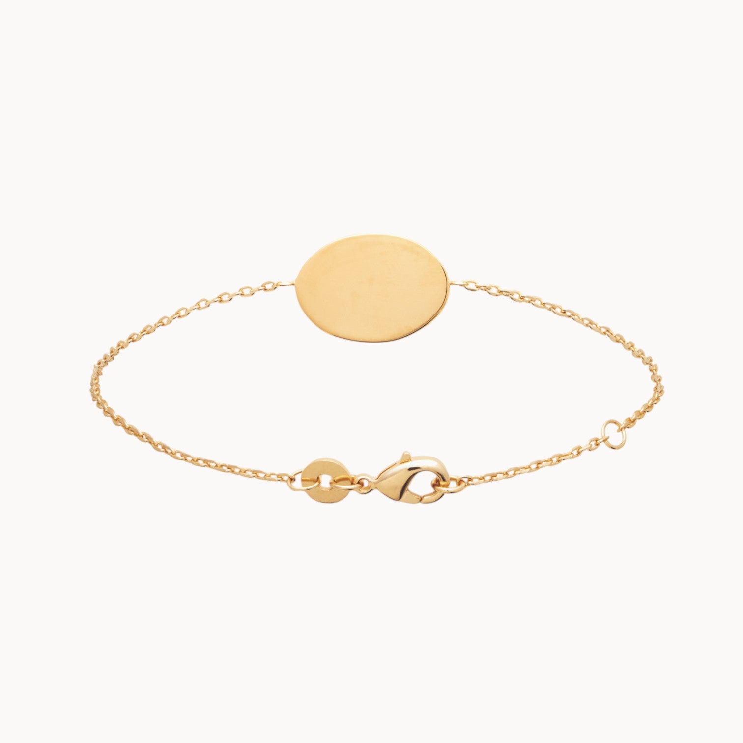 Bracelet Julia en plaqué or 18K, médaille ovale gravable, maille forçat fine, ajustable, bijou élégant et discret