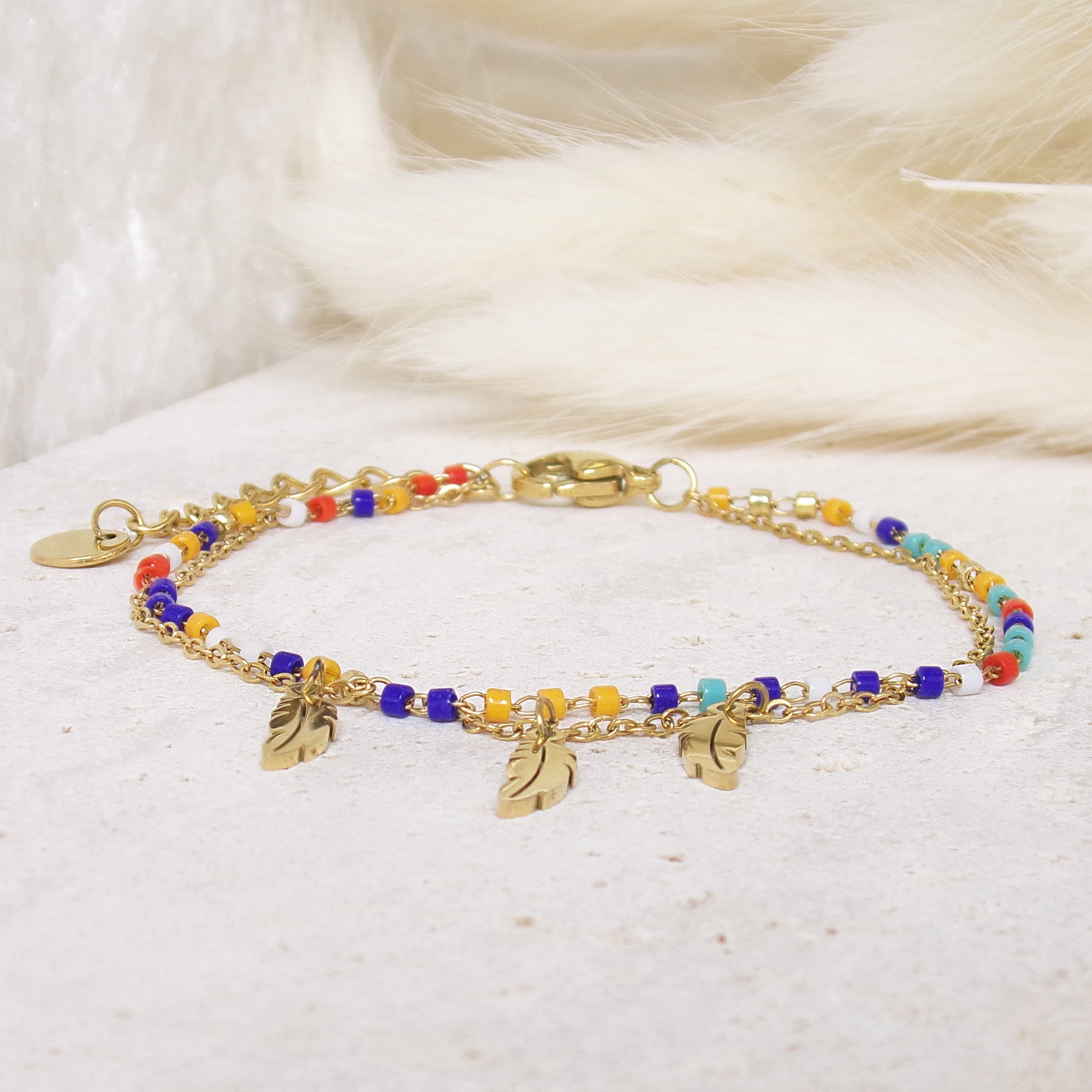 Sara double row bracelet with multicoloured pearls and feather pendants stainless steel