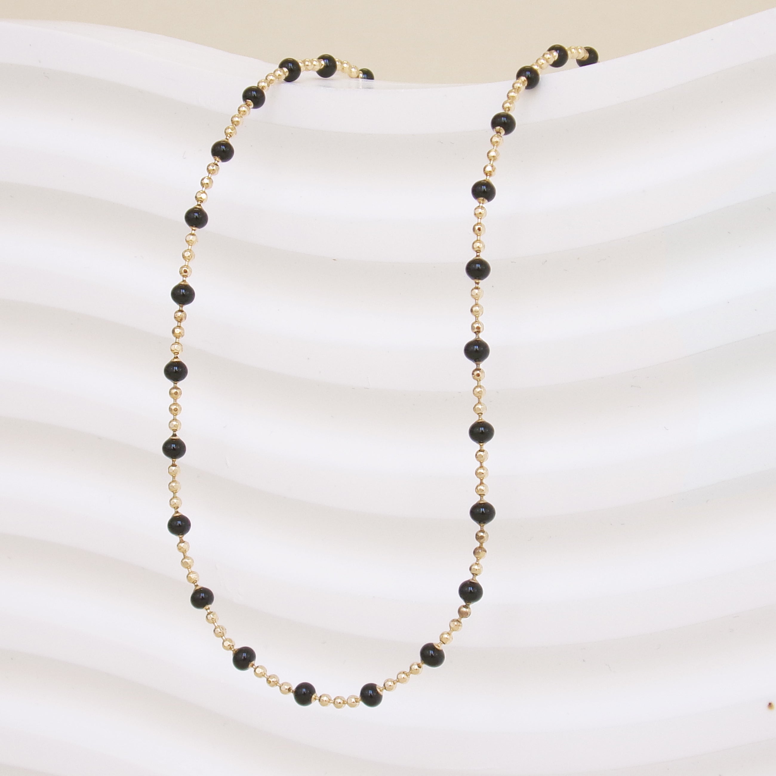 Black enamel beaded Almaria necklace with gold-plated mesh