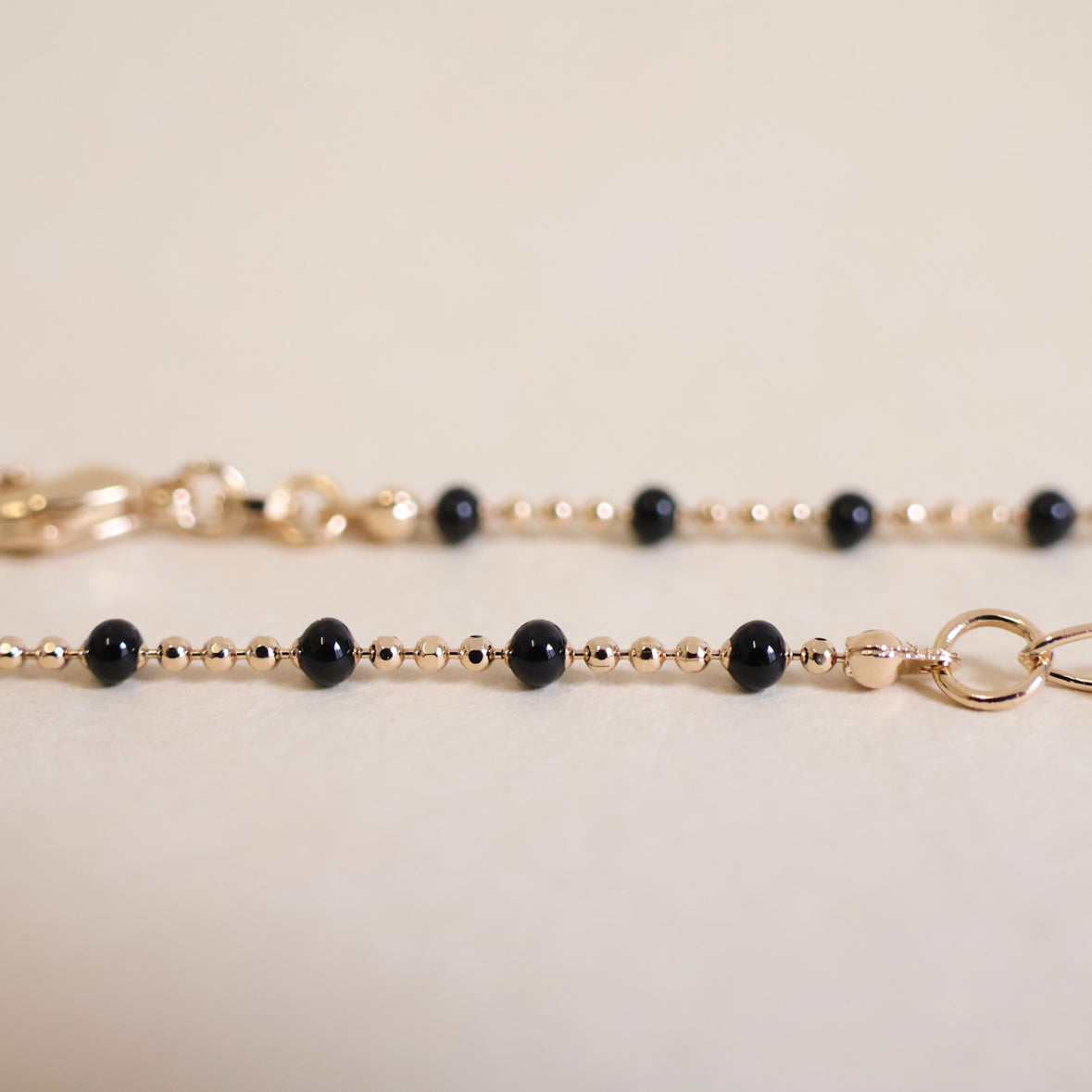 Black enamel beaded Almaria necklace with gold-plated mesh