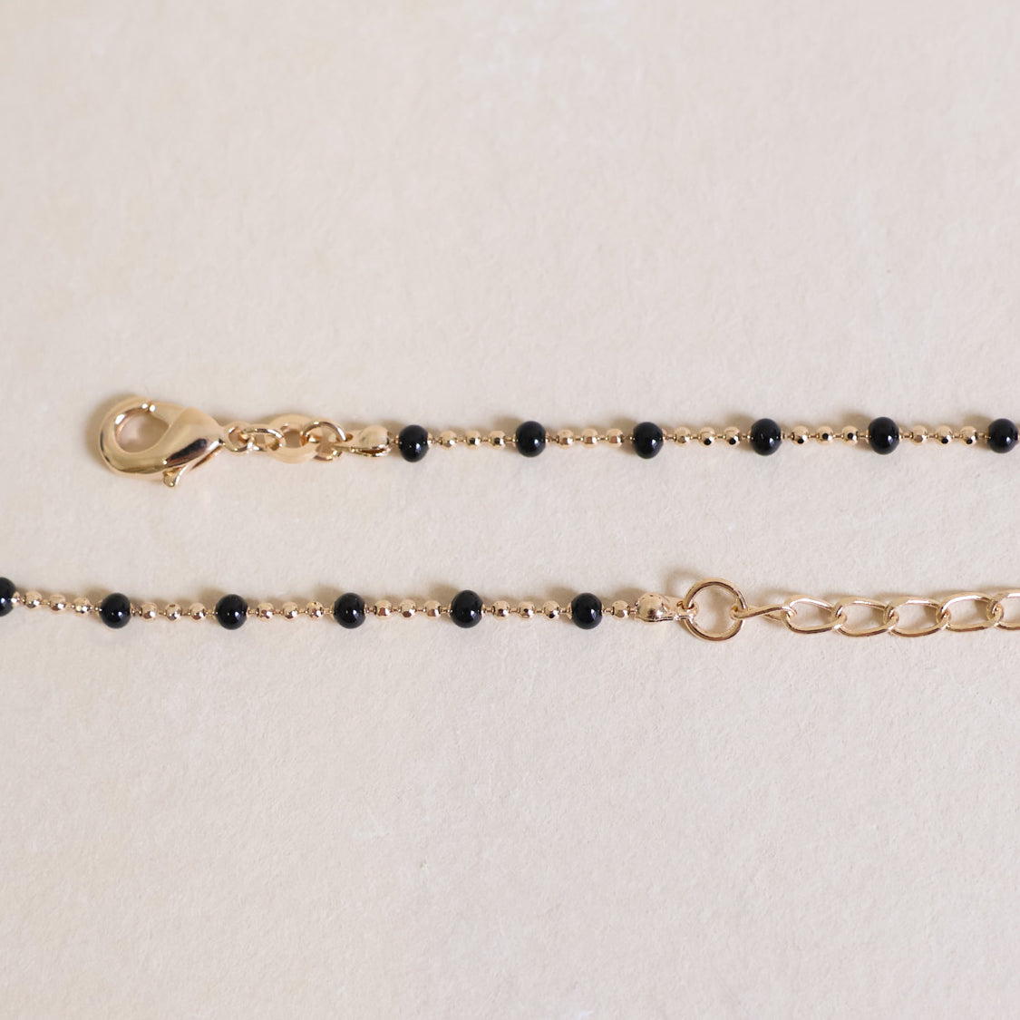 Black enamel beaded Almaria necklace with gold-plated mesh