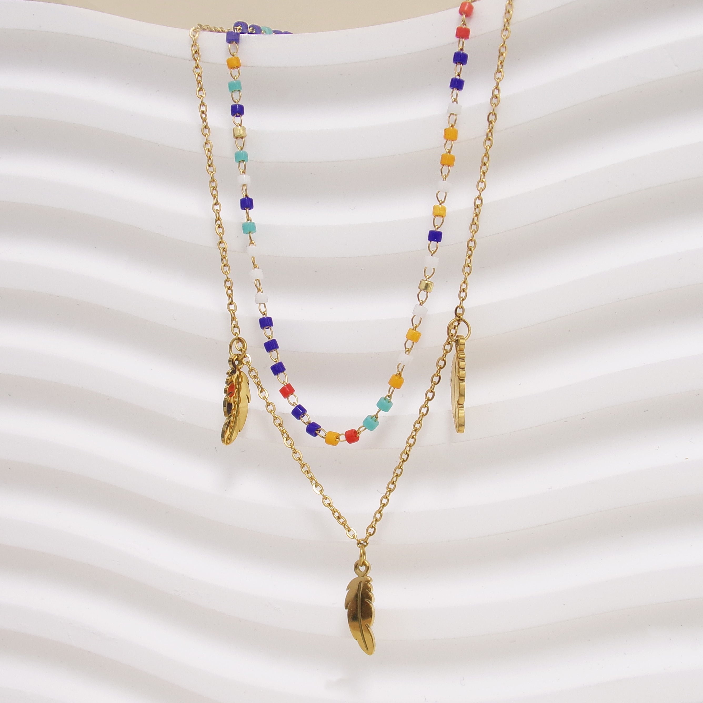 Double row Sara necklace with multicolored beads and stainless steel feather tassels