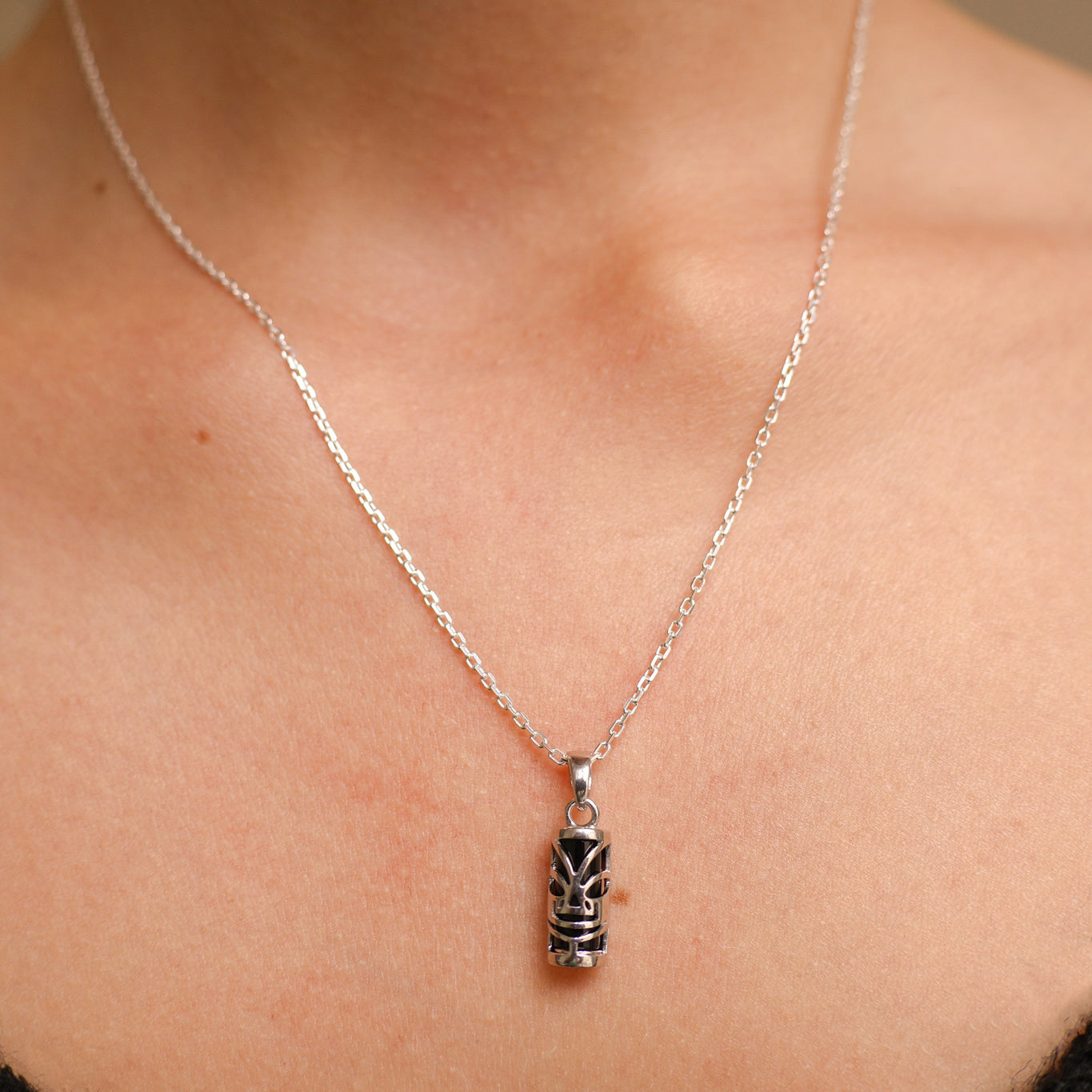 Polynesian Tiki pendant 5x10mm with silver onyx