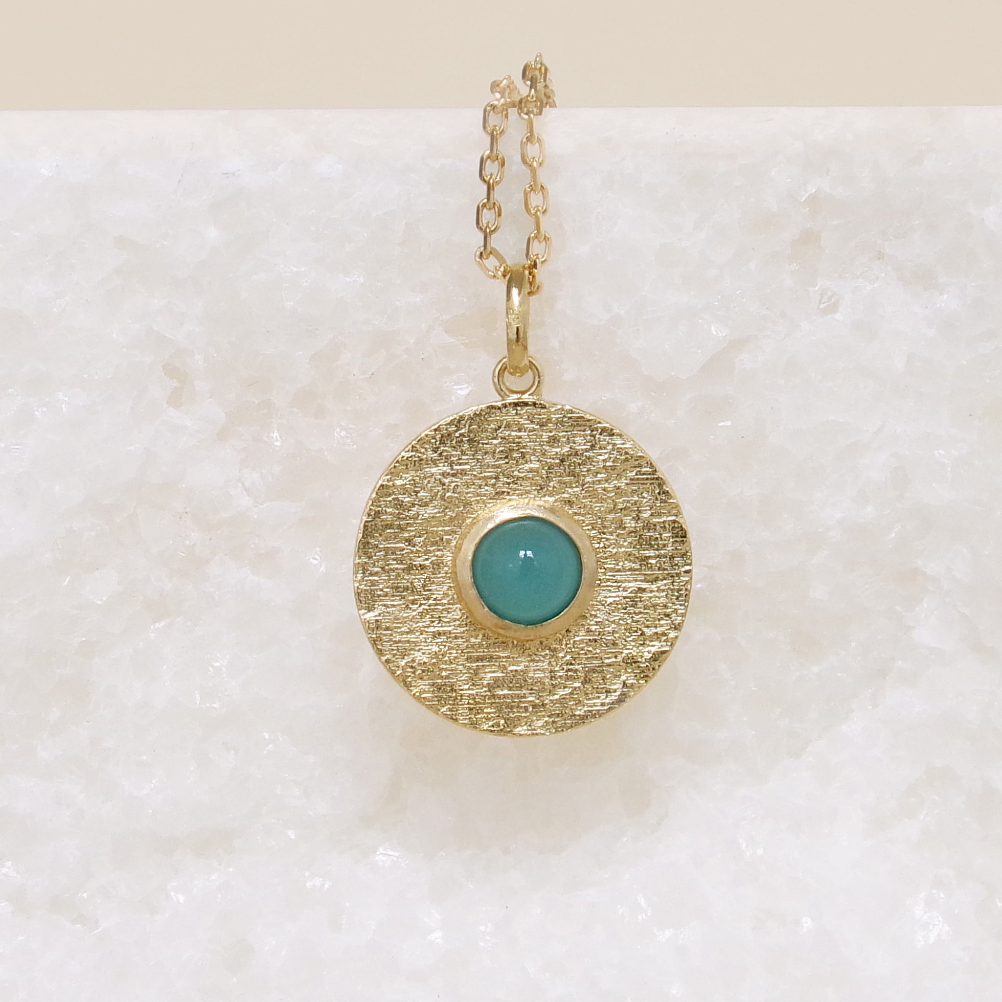 Round Layana pendant with satin finish, turquoise stone and gold plated