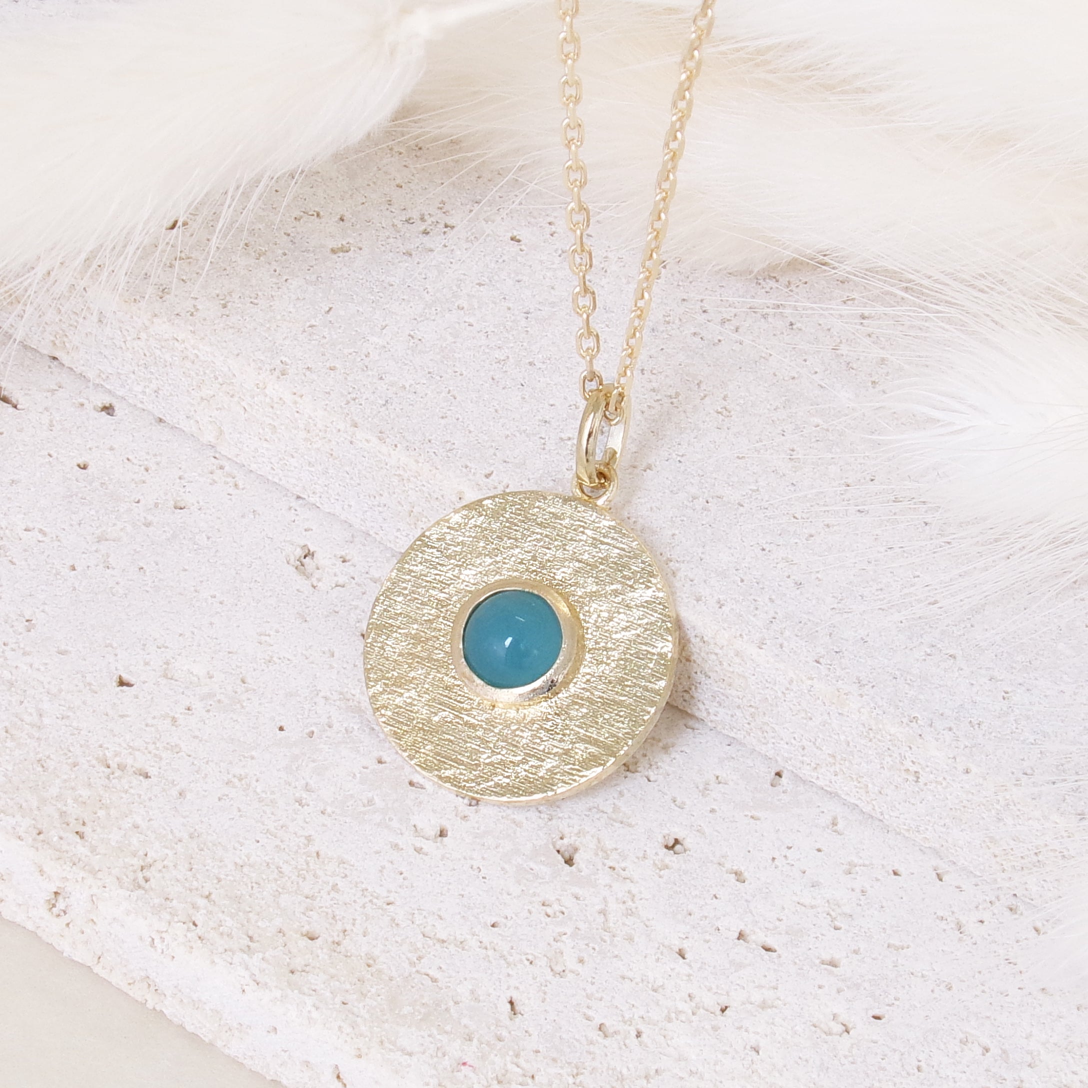 Round Layana pendant with satin finish, turquoise stone and gold plated
