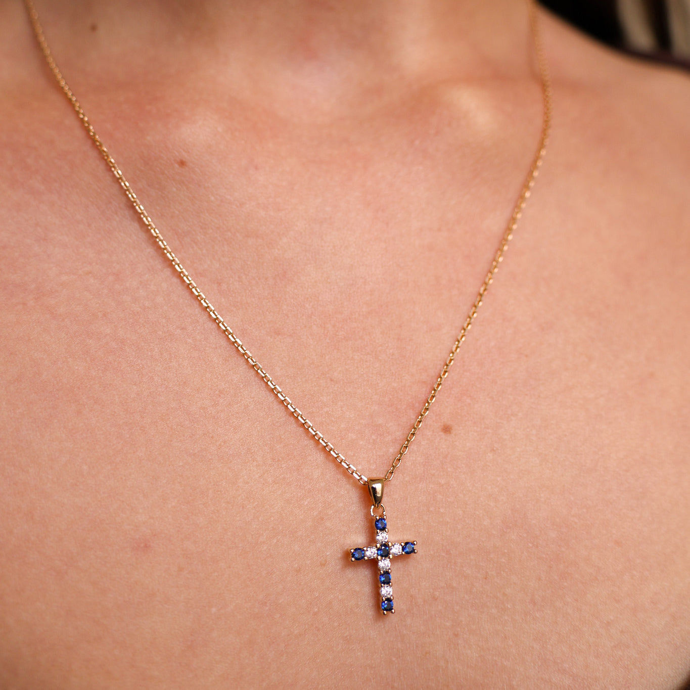 Gold-plated blue and white oxide cross pendant