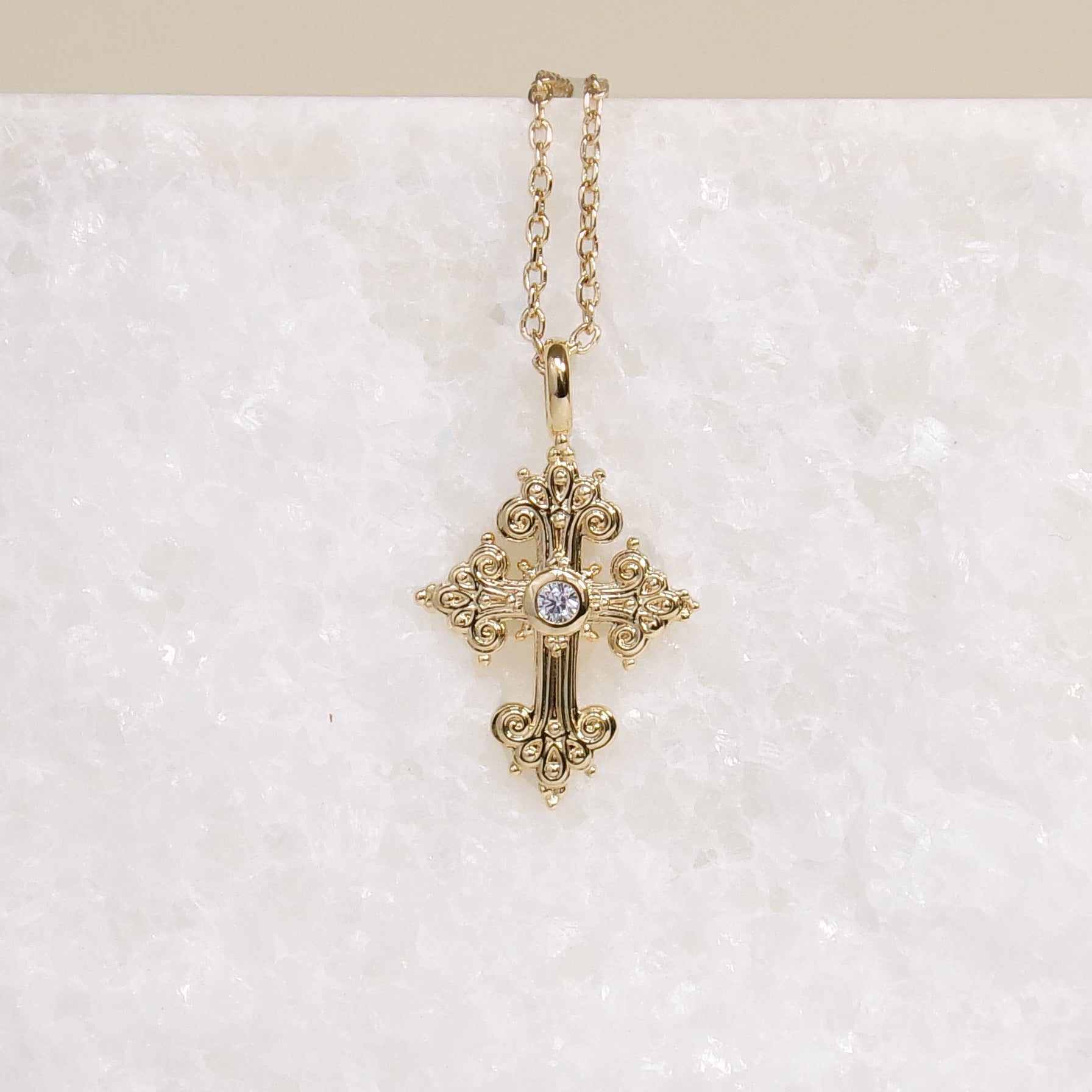 Stylized oxide and gold-plated cross pendant