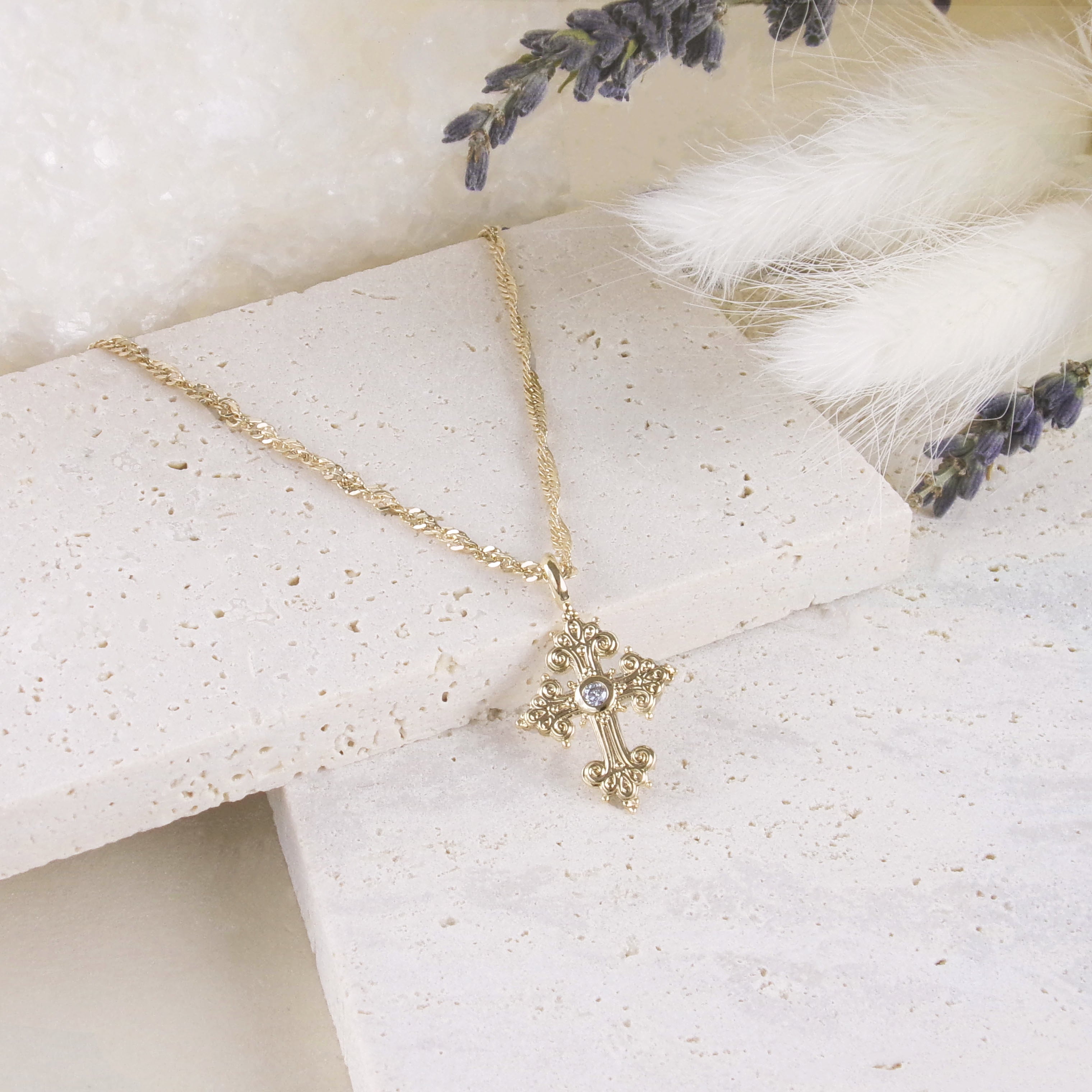 Stylized oxide and gold-plated cross pendant