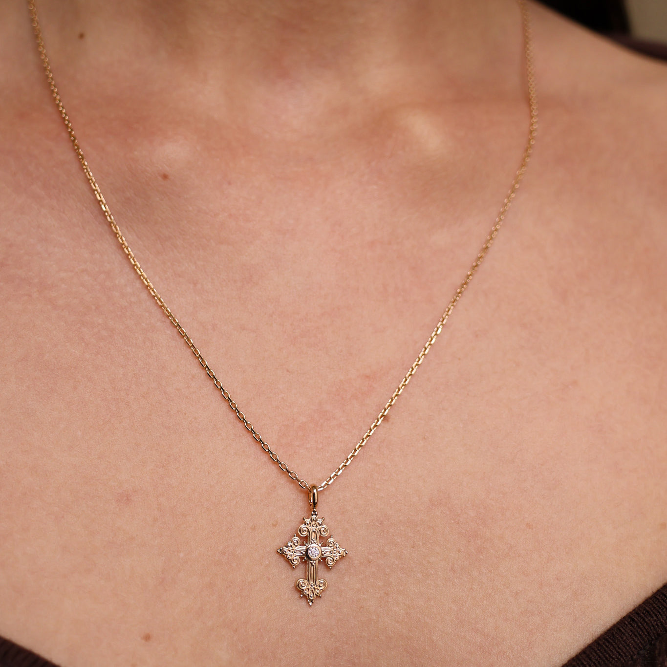 Stylized oxide and gold-plated cross pendant