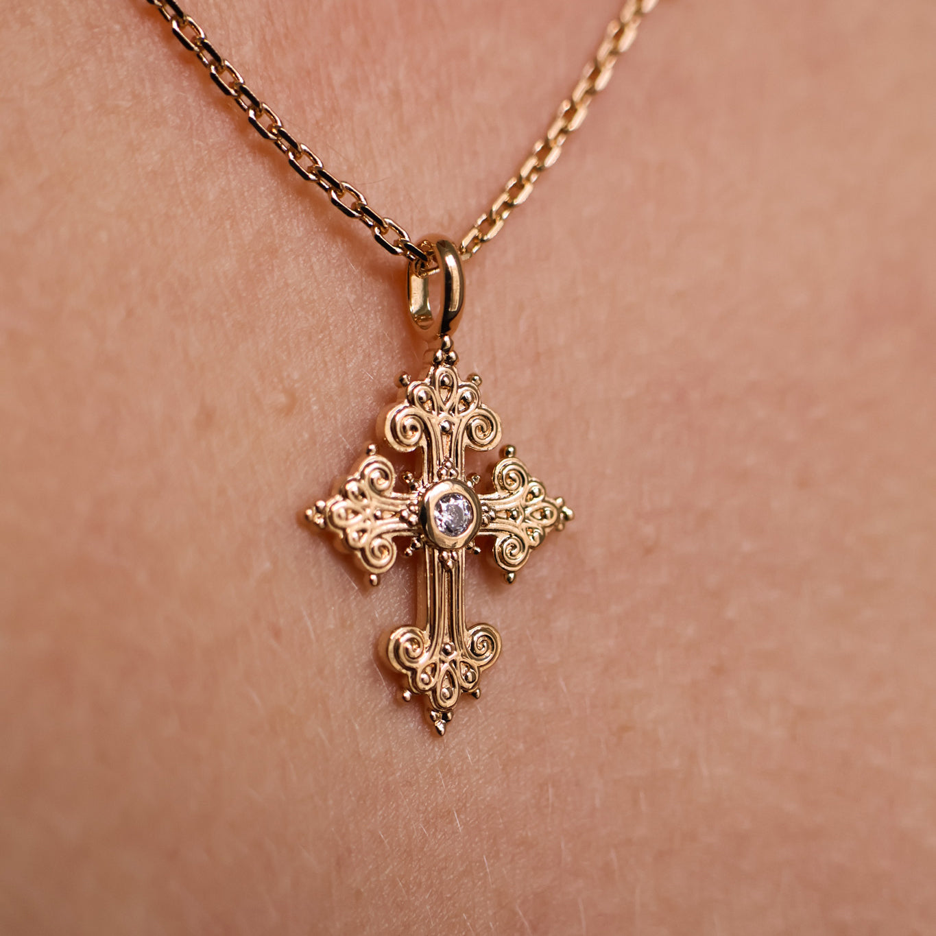 Stylized oxide and gold-plated cross pendant