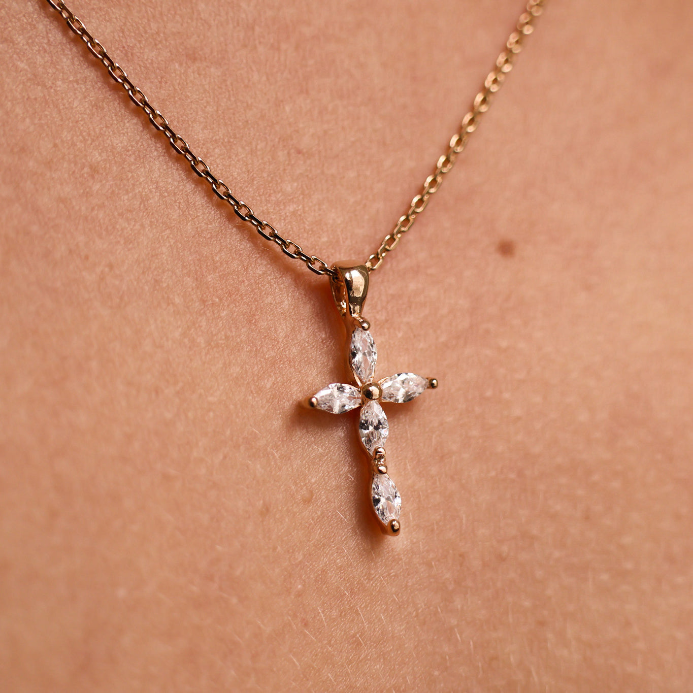 Religious cross pendant with oval oxides and gold plated