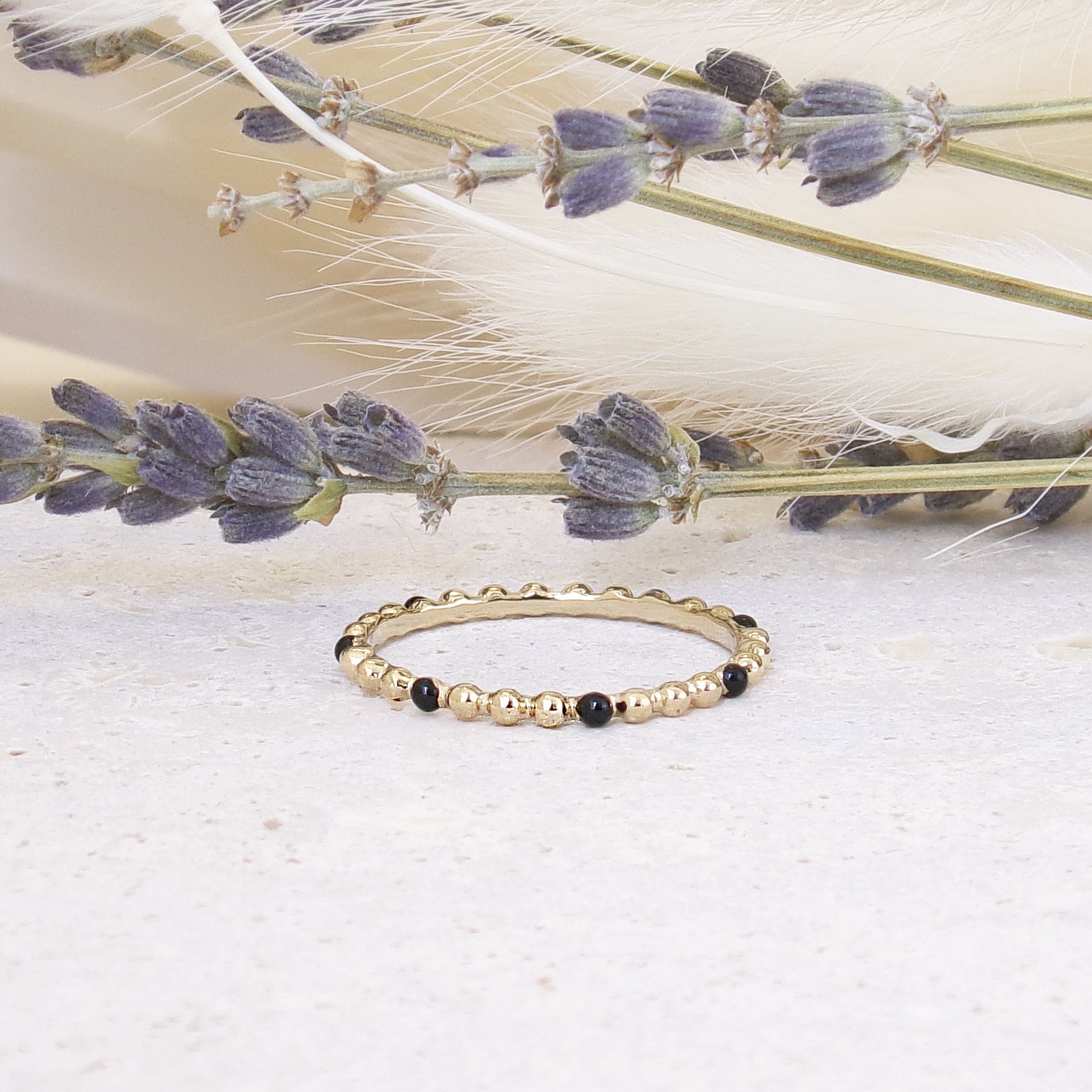 Dana beaded ring with black enamel gold-plated