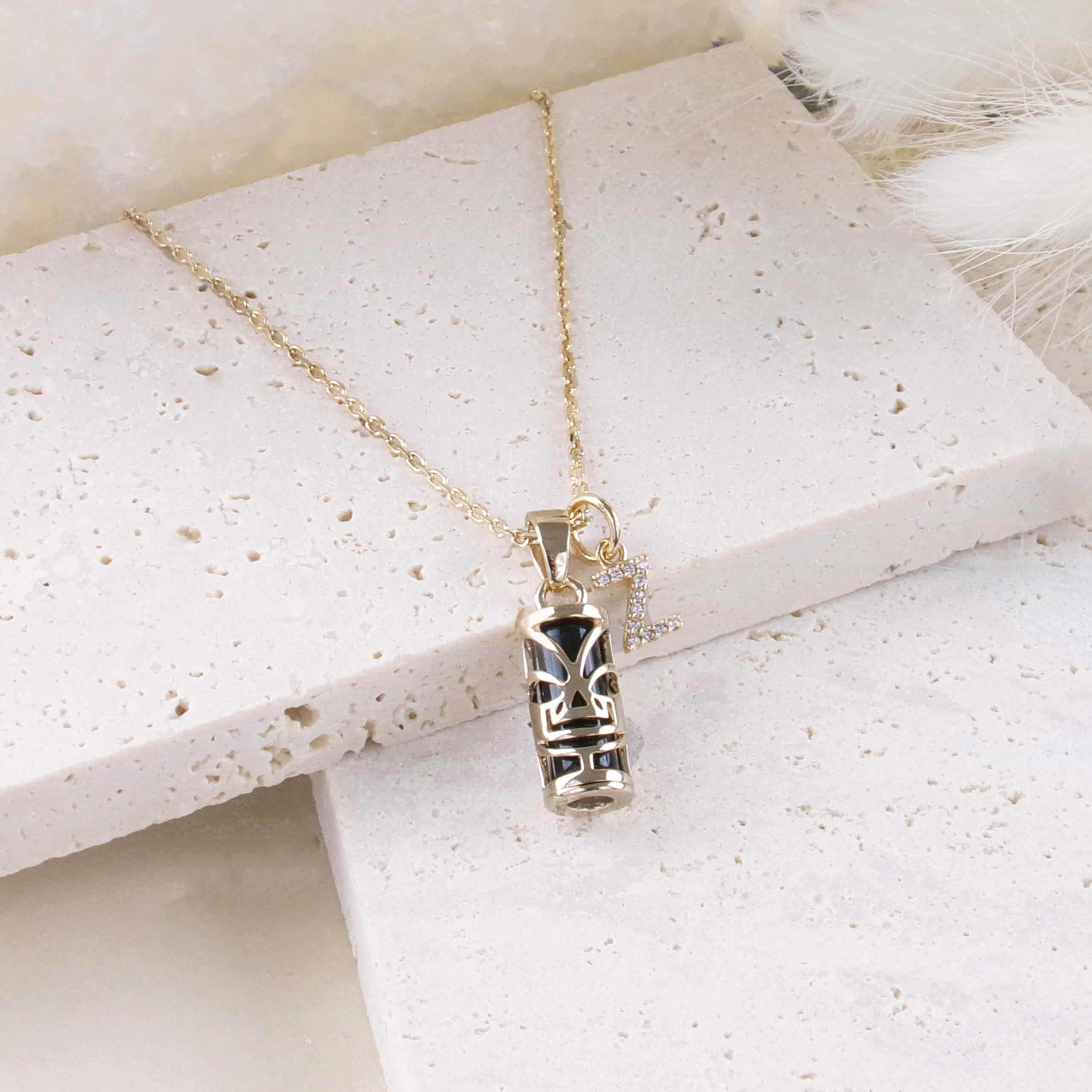Polynesian Tiki pendant 5x10mm with gold plated onyx